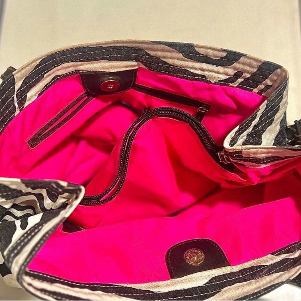 Vintage Dooney Bourke Zebra Canvas black/cream/hot pink Great used condition.